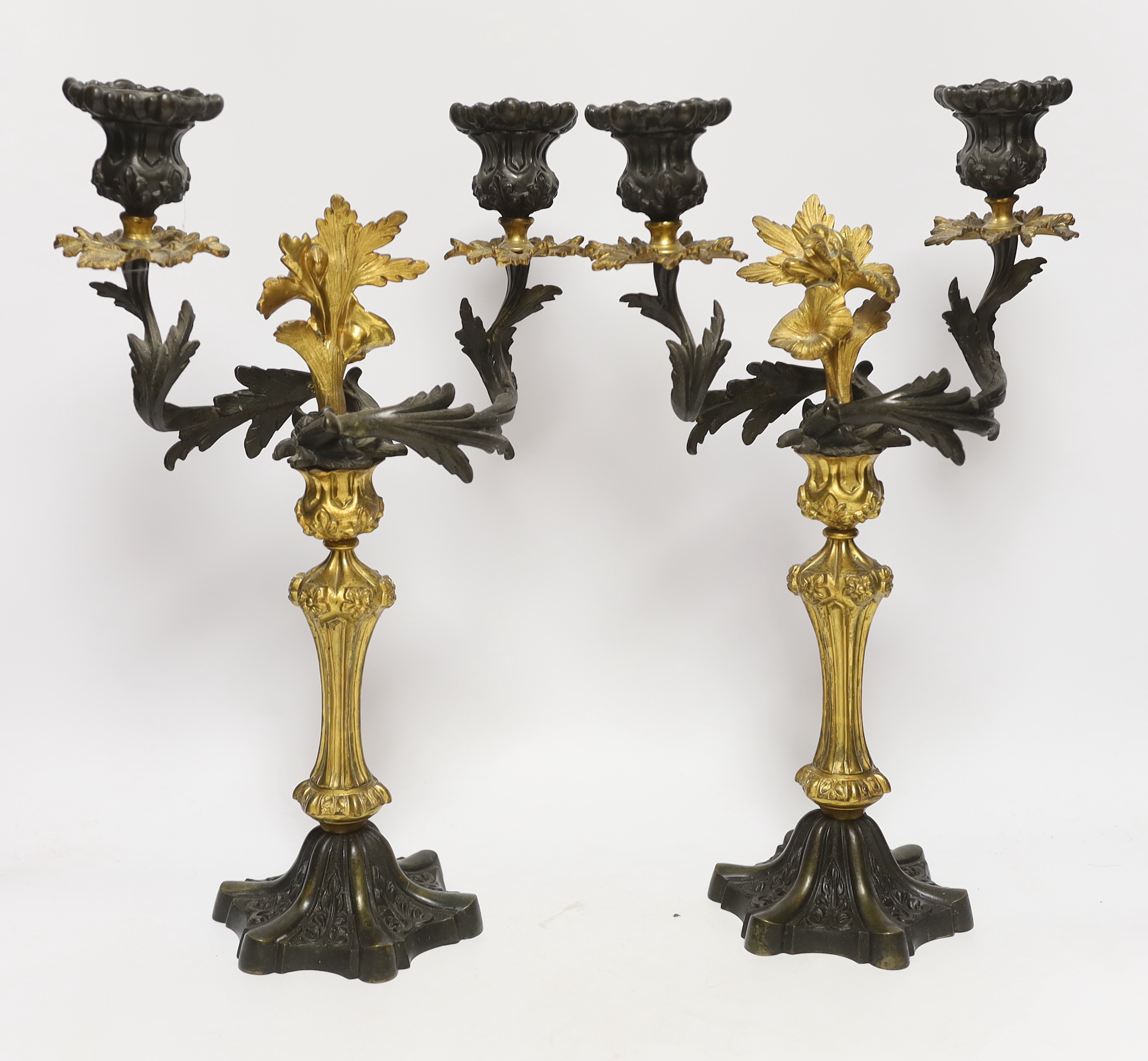 A pair of Victorian bronze and ormolu two branch candelabra, 39cm